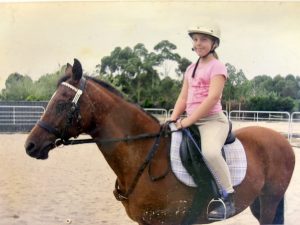 child sitting on a horse